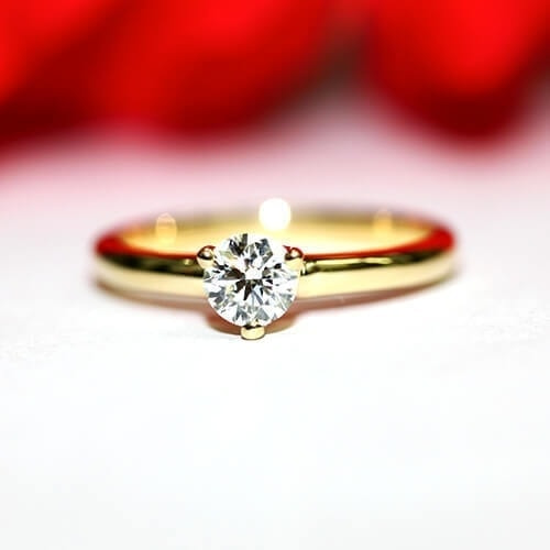K18イエローゴールドダイヤモンド婚約指輪　三本爪野球ボールモチーフ